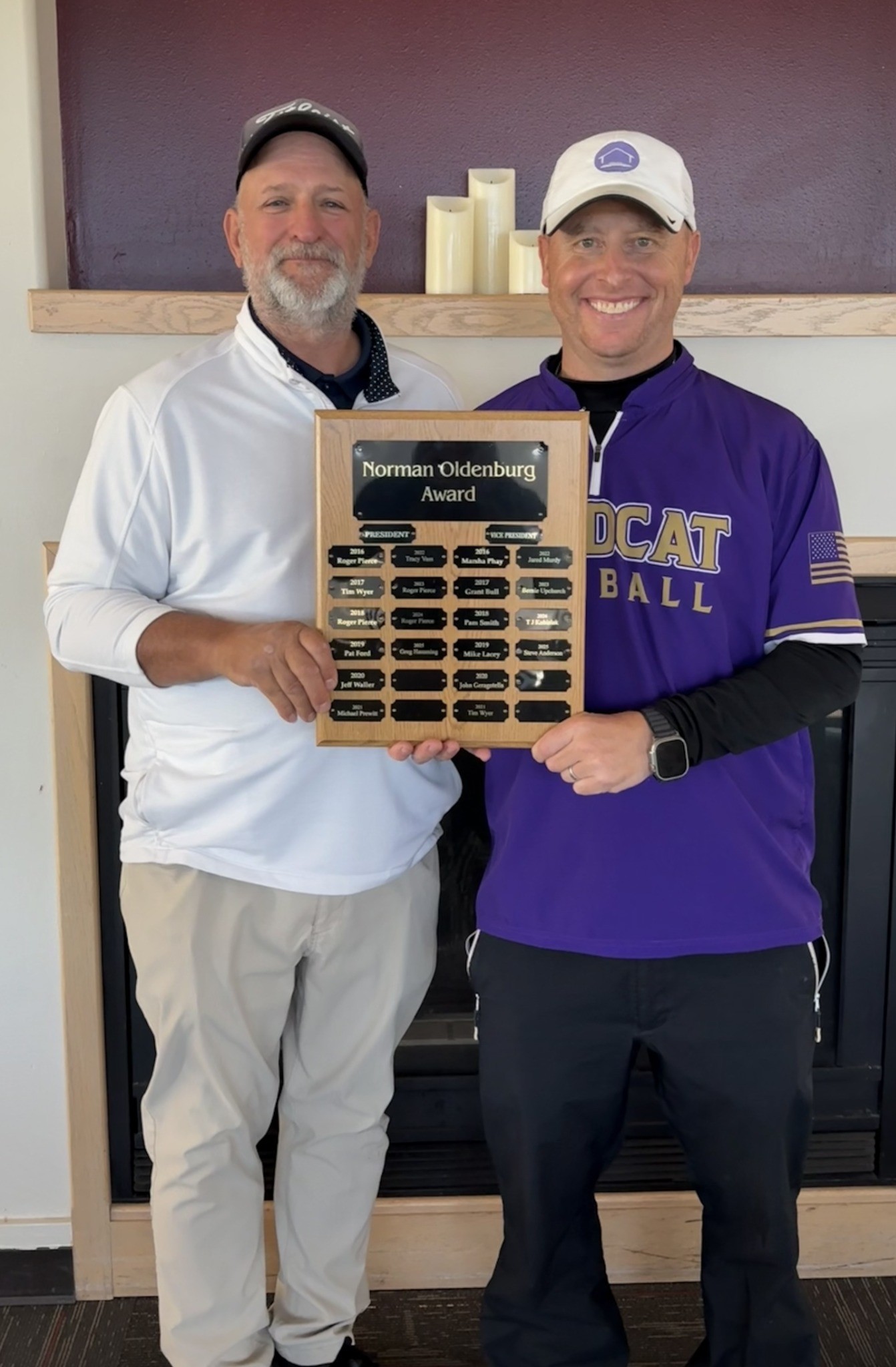 The 2026 Oldenburg Award recipients holding the Norman Oldenburg Award plaque